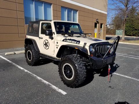 Professionally lifted 2011 Jeep Wrangler Sport 4&#215;4 for sale